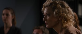 Movie still from “Truth” (2015), directed by James Vanderbilt – A person with blonde curly hair; Close Up shot, Over the shoulder angle