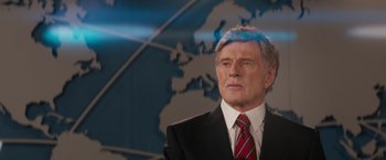 Movie still from “Truth” (2015), directed by James Vanderbilt – An older man wearing a suit and tie; Medium shot, Over the shoulder angle