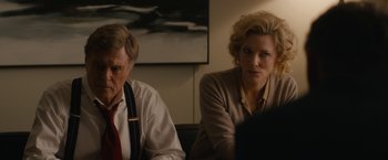 Movie still from “Truth” (2015), directed by James Vanderbilt – A man and a woman sitting next to each other in front of a computer; Medium shot, Over the shoulder angle