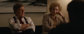 Movie still from “Truth” (2015), directed by James Vanderbilt – A woman sitting next to a man on a couch; Medium shot, Over the shoulder angle