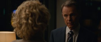 Movie still from “Truth” (2015), directed by James Vanderbilt – A man in a suit and tie looking at a woman in a suit; Close Up shot, Over the shoulder angle