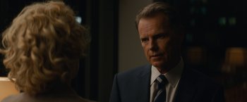 Movie still from “Truth” (2015), directed by James Vanderbilt – A man in a suit and tie looking at a woman in a dress; Close Up shot, Over the shoulder angle