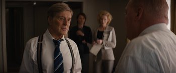 Movie still from “Truth” (2015), directed by James Vanderbilt – A man and two women standing in a room; Medium shot, Over the shoulder angle