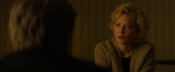 Movie still from “Truth” (2015), directed by James Vanderbilt – A woman sitting in front of a man in front of a window; Close Up shot, Over the shoulder angle