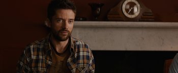 Movie still from “Truth” (2015), directed by James Vanderbilt – A person wearing a plaid shirt; Close Up shot, Over the shoulder angle