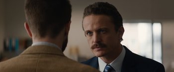 Movie still from “Truth” (2015), directed by James Vanderbilt – A man in a suit and tie looking at a man in a suit and tie; Close Up shot, Over the shoulder angle