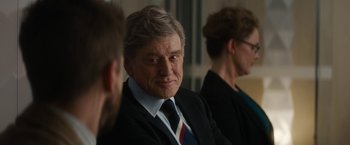 Movie still from “Truth” (2015), directed by James Vanderbilt – An older man wearing a suit and tie; Close Up shot, Over the shoulder angle