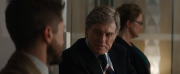 Movie still from “Truth” (2015), directed by James Vanderbilt – An older man wearing a suit and tie; Close Up shot, Over the shoulder angle
