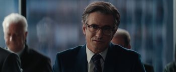 Movie still from “Truth” (2015), directed by James Vanderbilt – A person wearing a suit and tie; Close Up shot, Over the shoulder angle