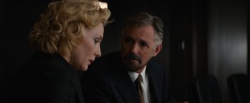 Movie still from “Truth” (2015), directed by James Vanderbilt – An older man and a younger woman in a suit; Close Up shot, Over the shoulder angle