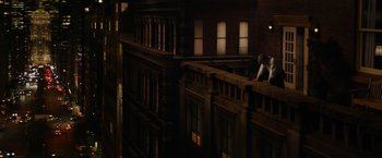 Movie still from “Truth” (2015), directed by James Vanderbilt – A man standing on top of a building on top of a building; Extreme Wide shot, High angle