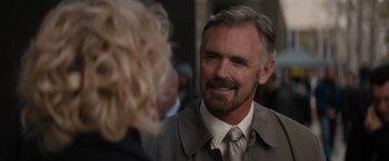 Movie still from “Truth” (2015), directed by James Vanderbilt – An older man in a gray jacket and a silver tie; Close Up shot, Over the shoulder angle