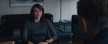 Movie still from “Truth” (2015), directed by James Vanderbilt – A woman sitting at a table in a room; Medium shot, Over the shoulder angle