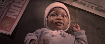 Movie still from “Tsotsi” (2005), directed by Gavin Hood – A baby wearing a hat; Close Up shot, High angle