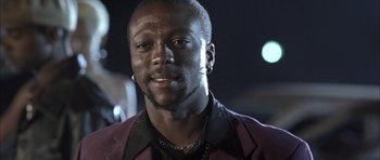 Movie still from “Tsotsi” (2005), directed by Gavin Hood – A person wearing a jacket; Close Up shot, Low angle