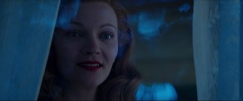 Movie still from “Tucker: The Man and His Dream” (1988), directed by Francis Ford Coppola – A person's face with blue lights in the background; Close Up shot, Low angle