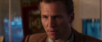 Movie still from “Tucker: The Man and His Dream” (1988), directed by Francis Ford Coppola – A person wearing a suit and tie; Close Up shot, Low angle