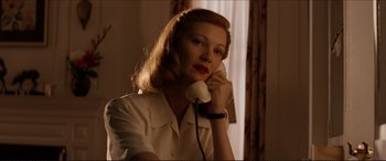 Movie still from “Tucker: The Man and His Dream” (1988), directed by Francis Ford Coppola – A woman talking on a phone while sitting in a room; Close Up shot, Low angle