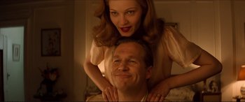 Movie still from “Tucker: The Man and His Dream” (1988), directed by Francis Ford Coppola – A man and a woman pose for a picture; Close Up shot, Low angle