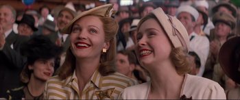 Movie still from “Tucker: The Man and His Dream” (1988), directed by Francis Ford Coppola – A couple of women standing next to each other in a crowd; Close Up shot, Low angle