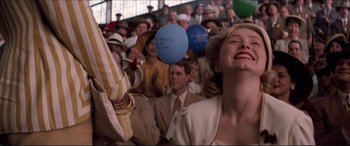 Movie still from “Tucker: The Man and His Dream” (1988), directed by Francis Ford Coppola – A crowd of people sitting and standing in a room; Medium shot, Low angle