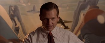 Movie still from “Tucker: The Man and His Dream” (1988), directed by Francis Ford Coppola – A person wearing a shirt and a tie; Close Up shot, Over the shoulder angle