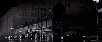 Movie still from “Tucker: The Man and His Dream” (1988), directed by Francis Ford Coppola – A building that is lit up at night time; Extreme Wide shot, Low angle
