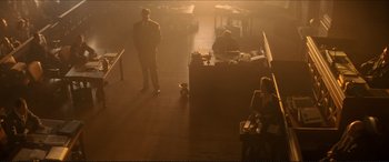Movie still from “Tucker: The Man and His Dream” (1988), directed by Francis Ford Coppola – A man and a woman are standing in a dimly - lit room; Extreme Wide shot, High angle