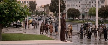 Movie still from “Tucker: The Man and His Dream” (1988), directed by Francis Ford Coppola – A crowd of people walking down a street; Extreme Wide shot, High angle