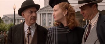 Movie still from “Tucker: The Man and His Dream” (1988), directed by Francis Ford Coppola – An older man standing next to an older woman; Medium shot, Low angle