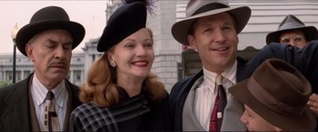 Movie still from “Tucker: The Man and His Dream” (1988), directed by Francis Ford Coppola – A man and a woman wearing hats and ties; Medium shot, Low angle