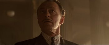 Movie still from “Tucker: The Man and His Dream” (1988), directed by Francis Ford Coppola – An old man with a mustache wearing a suit and tie; Close Up shot, Low angle