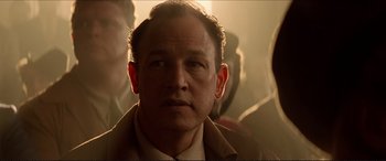 Movie still from “Tucker: The Man and His Dream” (1988), directed by Francis Ford Coppola – A person wearing a suit and tie; Close Up shot, Low angle