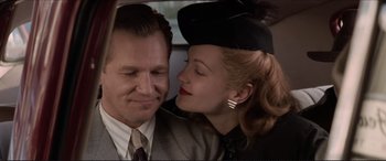 Movie still from “Tucker: The Man and His Dream” (1988), directed by Francis Ford Coppola – A man and a woman sitting in the back of a car; Close Up shot, Low angle