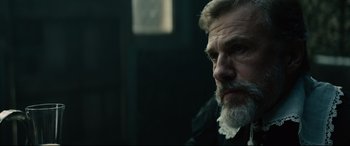 Movie still from “Tulip Fever” (2017), directed by Justin Chadwick – A person with a beard; Close Up shot, Over the shoulder angle