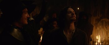 Movie still from “Tulip Fever” (2017), directed by Justin Chadwick – A group of people standing in a room; Medium shot, Low angle