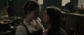 Movie still from “Tulip Fever” (2017), directed by Justin Chadwick – A man and a woman are kissing in a dark room; Close Up shot, Low angle