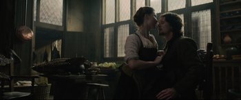 Movie still from “Tulip Fever” (2017), directed by Justin Chadwick – A woman and a young man in a kitchen; Medium shot, Low angle