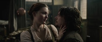 Movie still from “Tulip Fever” (2017), directed by Justin Chadwick – A man and a woman standing next to each other; Close Up shot, Low angle