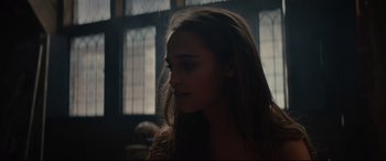 Movie still from “Tulip Fever” (2017), directed by Justin Chadwick – A woman with long hair is looking to her left; Close Up shot, Over the shoulder angle