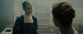 Movie still from “Tulip Fever” (2017), directed by Justin Chadwick – A woman in a black and white dress standing in front of another woman in a white dress; Close Up shot, Over the shoulder angle