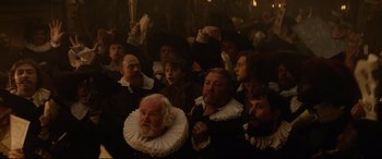 Movie still from “Tulip Fever” (2017), directed by Justin Chadwick – A group of people dressed in renaissance clothing; Medium shot, High angle