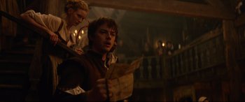 Movie still from “Tulip Fever” (2017), directed by Justin Chadwick – A man and a woman are looking at a map; Medium shot, Low angle