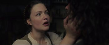Movie still from “Tulip Fever” (2017), directed by Justin Chadwick – A woman looking at a man with his hand on his face; Close Up shot, Over the shoulder angle