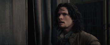 Movie still from “Tulip Fever” (2017), directed by Justin Chadwick – A person with long black hair; Close Up shot, Over the shoulder angle