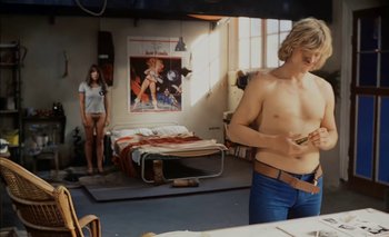 Movie still from “Turkish Delight” (1973), directed by Paul Verhoeven – A man in a room next to a woman in a bedroom; Medium shot, Low angle