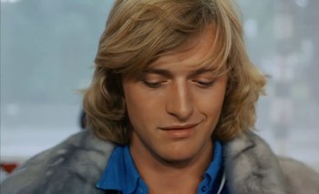 Movie still from “Turkish Delight” (1973), directed by Paul Verhoeven – A person with long blond hair; Close Up shot, Over the shoulder angle