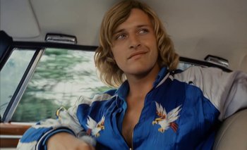 Movie still from “Turkish Delight” (1973), directed by Paul Verhoeven – A man sitting in the back seat of a car; Close Up shot, Low angle