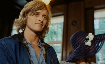 Movie still from “Turkish Delight” (1973), directed by Paul Verhoeven – A person with long blonde hair; Close Up shot, Over the shoulder angle