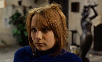 Movie still from “Turkish Delight” (1973), directed by Paul Verhoeven – A person wearing a blue shirt; Close Up shot, Over the shoulder angle